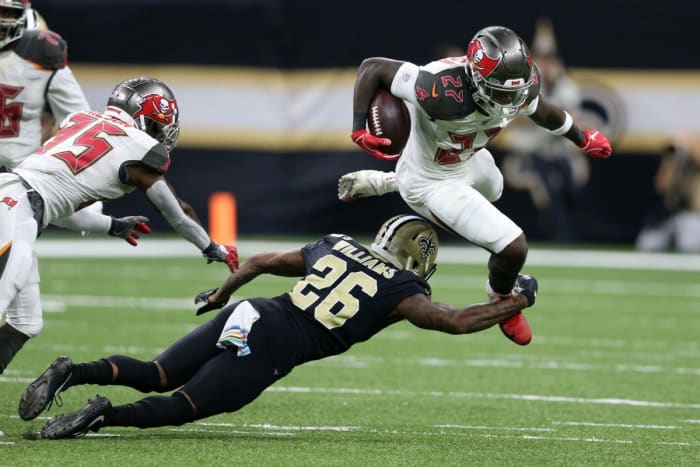 Tampa Bay running back Ronald Jones (27) is tackled by Saints cornerback P.J. Williams (26). Mandatory Credit: Chuck Cook-USA TODAY